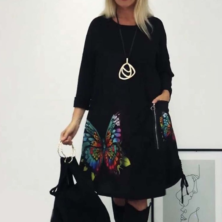 Dámské šaty volného střihu s kulatým výstřihem ve tvaru motýla