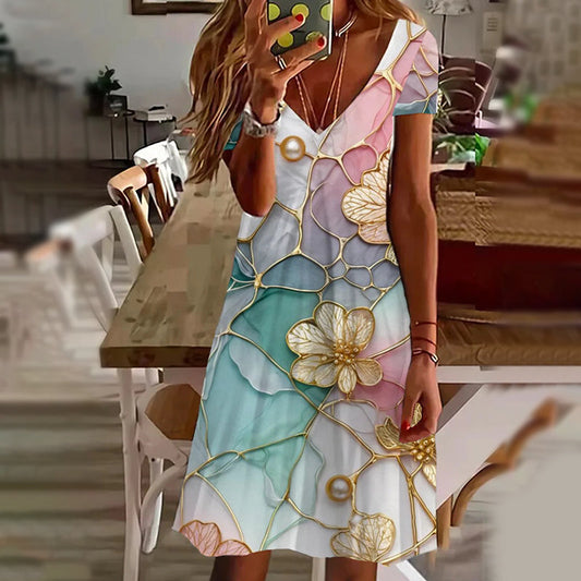 Elegantní dámské šaty s potiskem a výstřihem do V