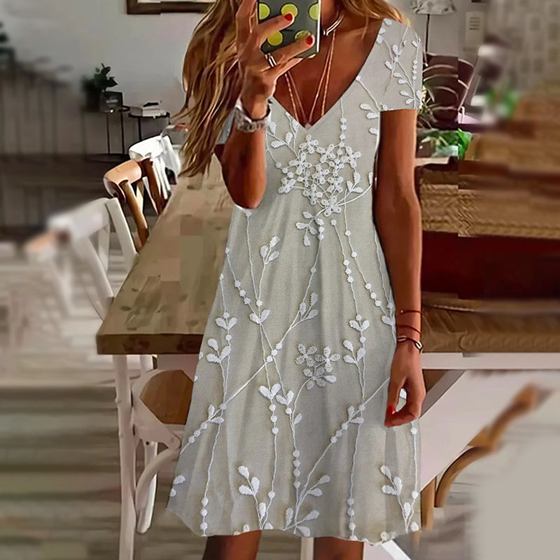 Elegantní dámské šaty s potiskem a výstřihem do V