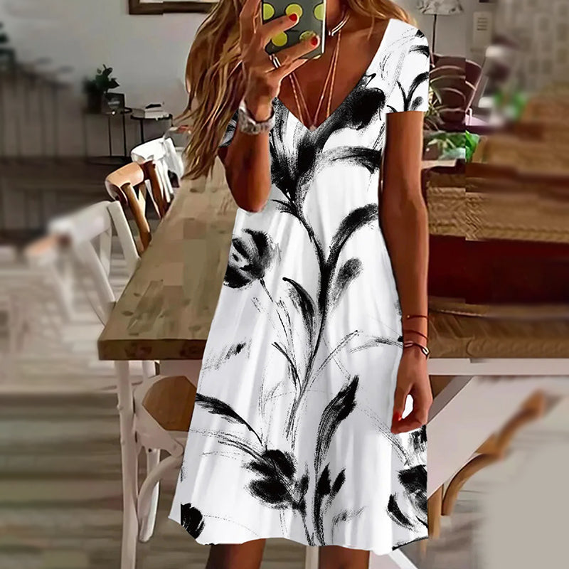 Elegantní dámské šaty s potiskem a výstřihem do V