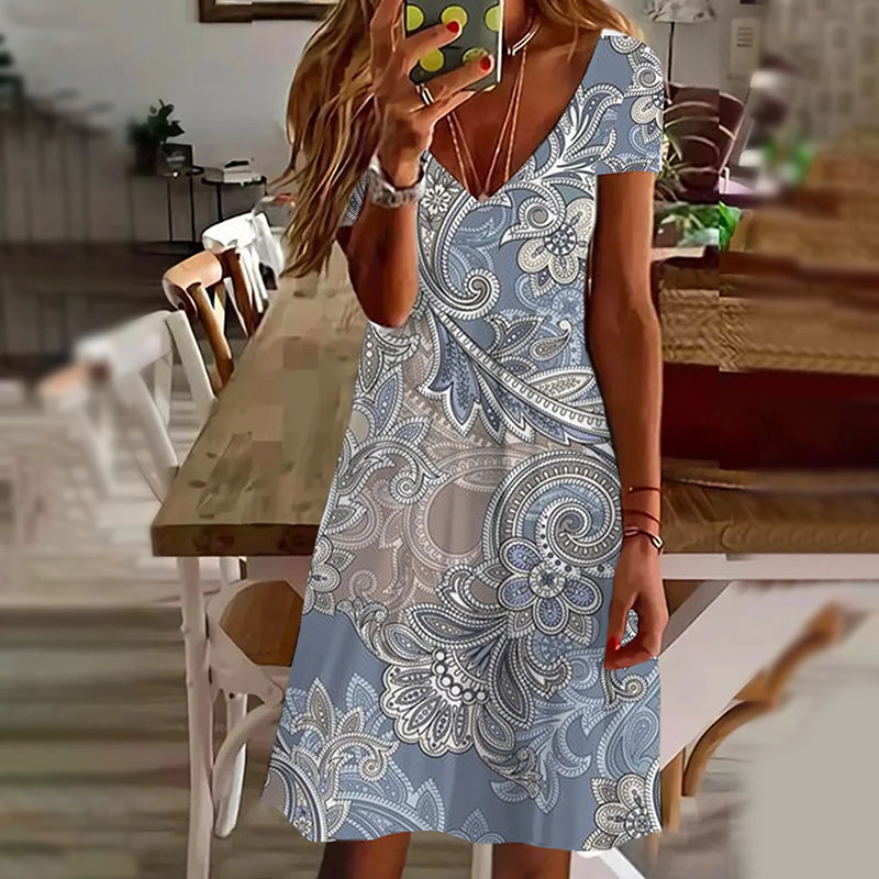 Elegantní dámské šaty s potiskem a výstřihem do V